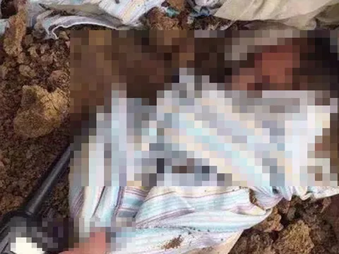 Phát hiện thi thể bé trai sơ sinh bị chôn vùi trước cửa nhà kho