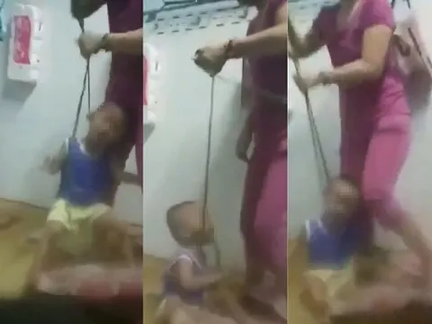 Bé trai bị mẹ bạo hành, buộc dây vào cổ