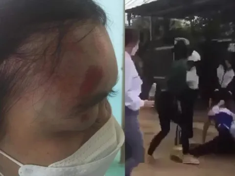 Nữ sinh lớp 11 bị nhóm người đánh hội đồng dã man trước cổng trường